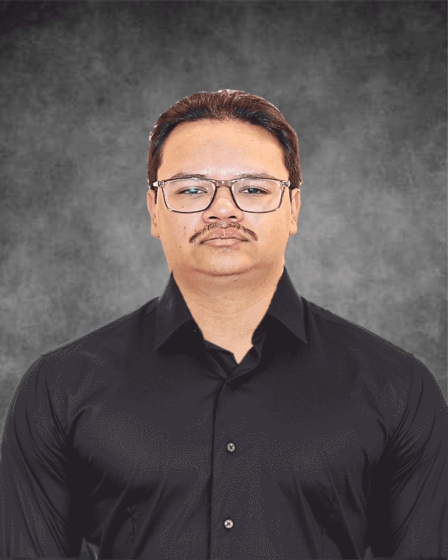 Man wearing glasses and a black shirt against a gray textured background.
