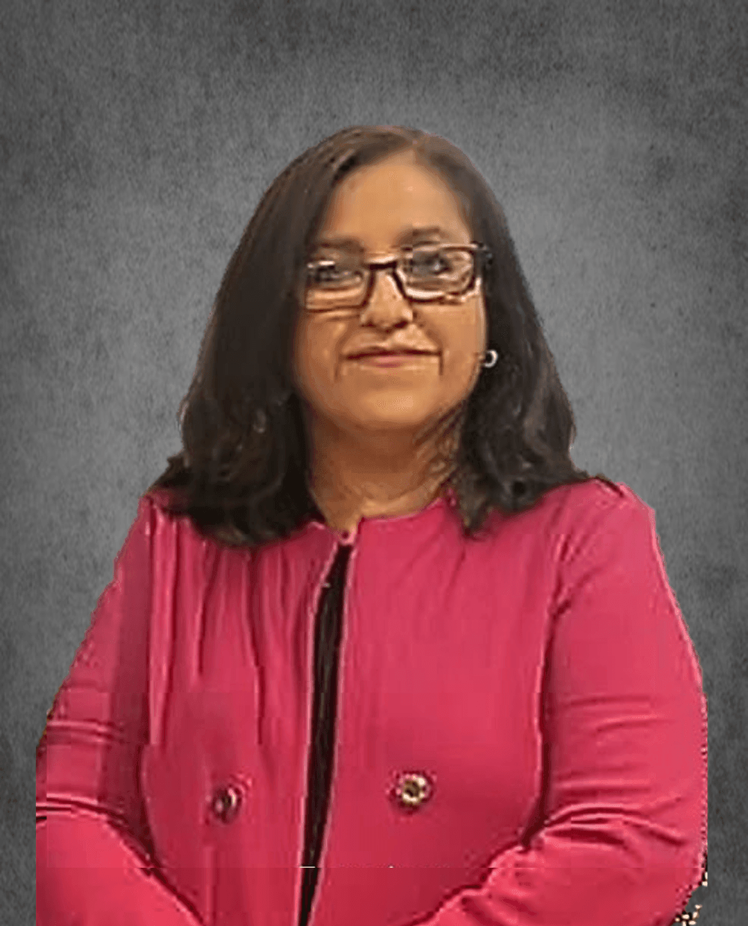 Person with long dark hair and glasses, wearing a pink jacket against a gray background.